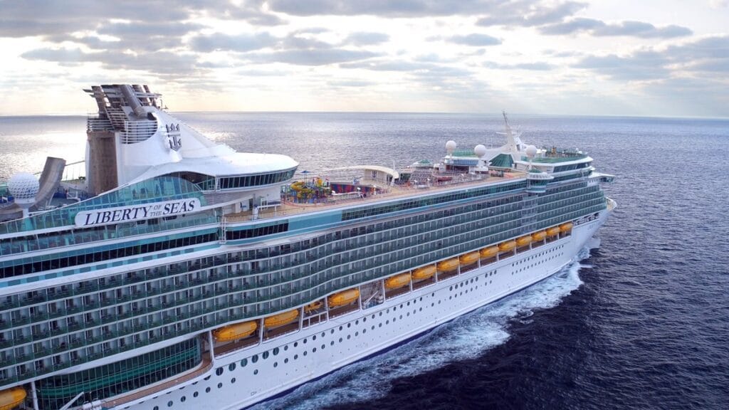 LB, Liberty of the Seas, revite with slides 2016, still grab from drone video, 3/4 starboard side view, ocean, horizon, clouds,