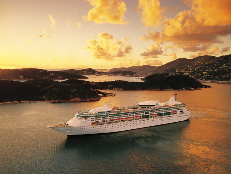 Rhapsody of the Seas sailing at sunset