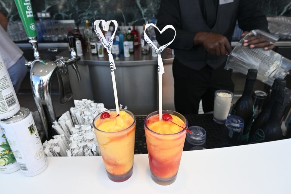 Two fruity cocktails on the pool deck of a Celebrity cruise