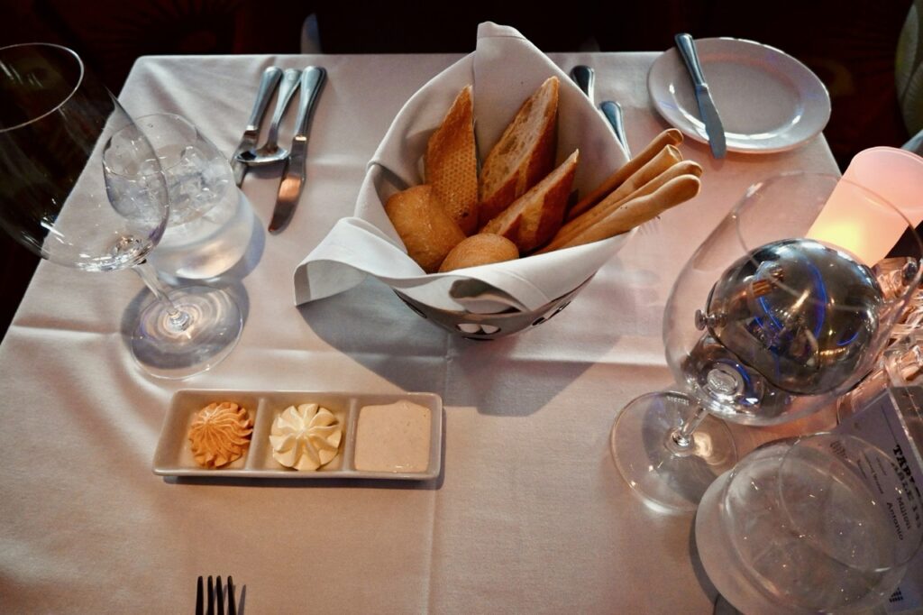 Bread basket and butter at a table in the main dining room