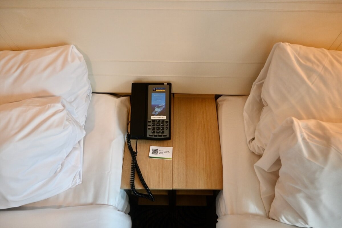 Phone and nightstand in a balcony cabin on Anthem of the Seas