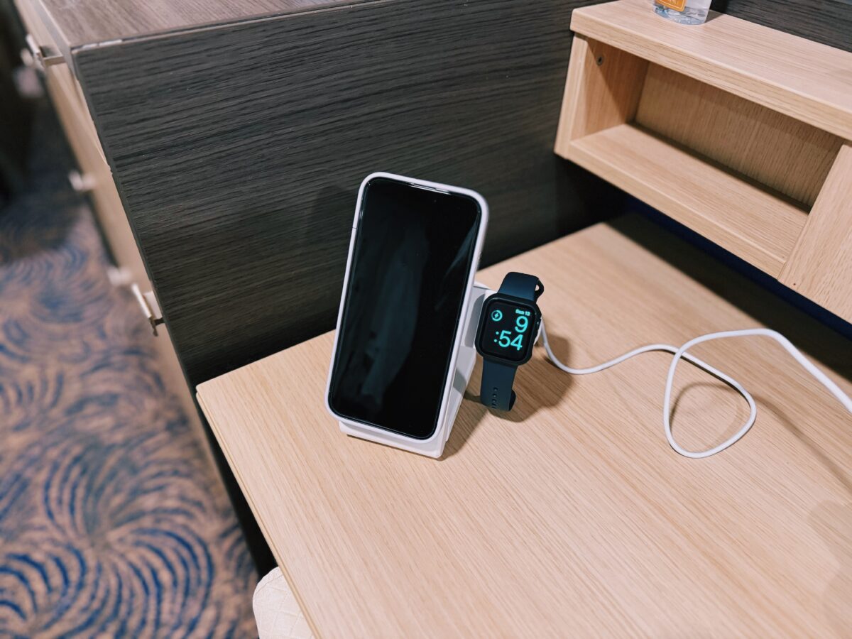 Changing stand for phone and smart watch in cruise cabin