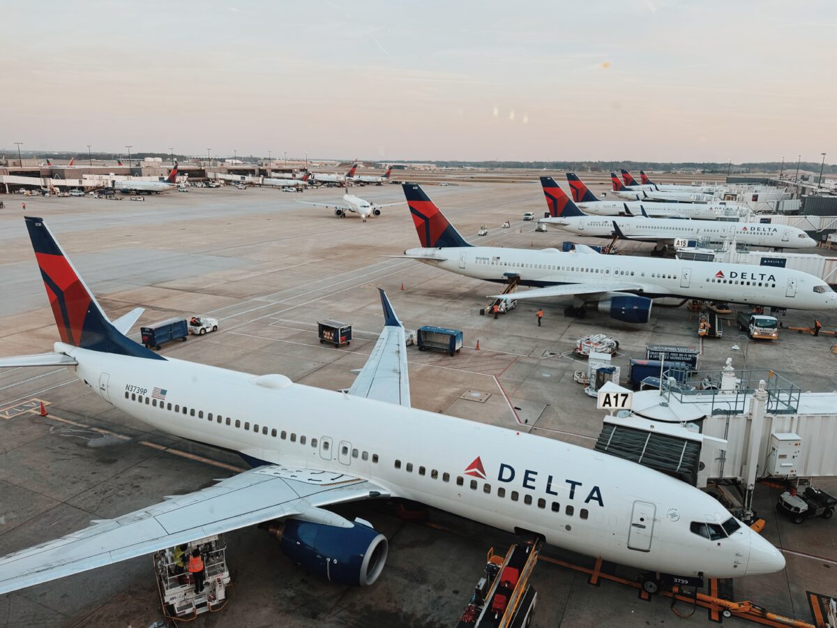 Delta airplanes lined up at an airport