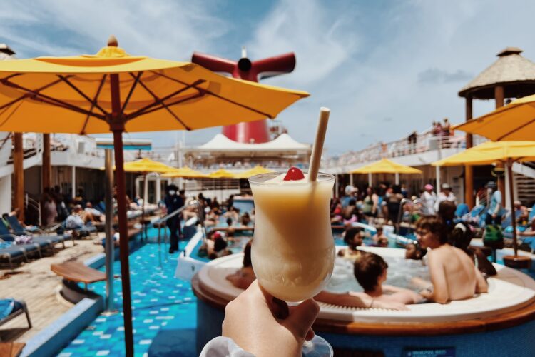 Pina colada on the pool deck of a Carnival cruise