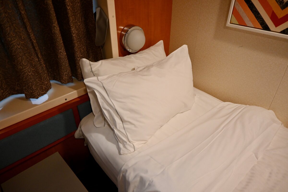 Cruise cabin pillows on bed