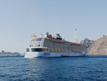 Odyssey of the Seas and NCL Dawn docked in Santorini, Greece