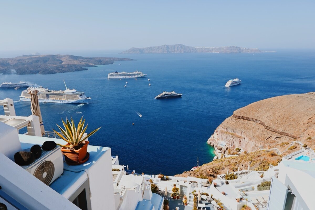 Multiple cruise ships docked in Santorini, Greece