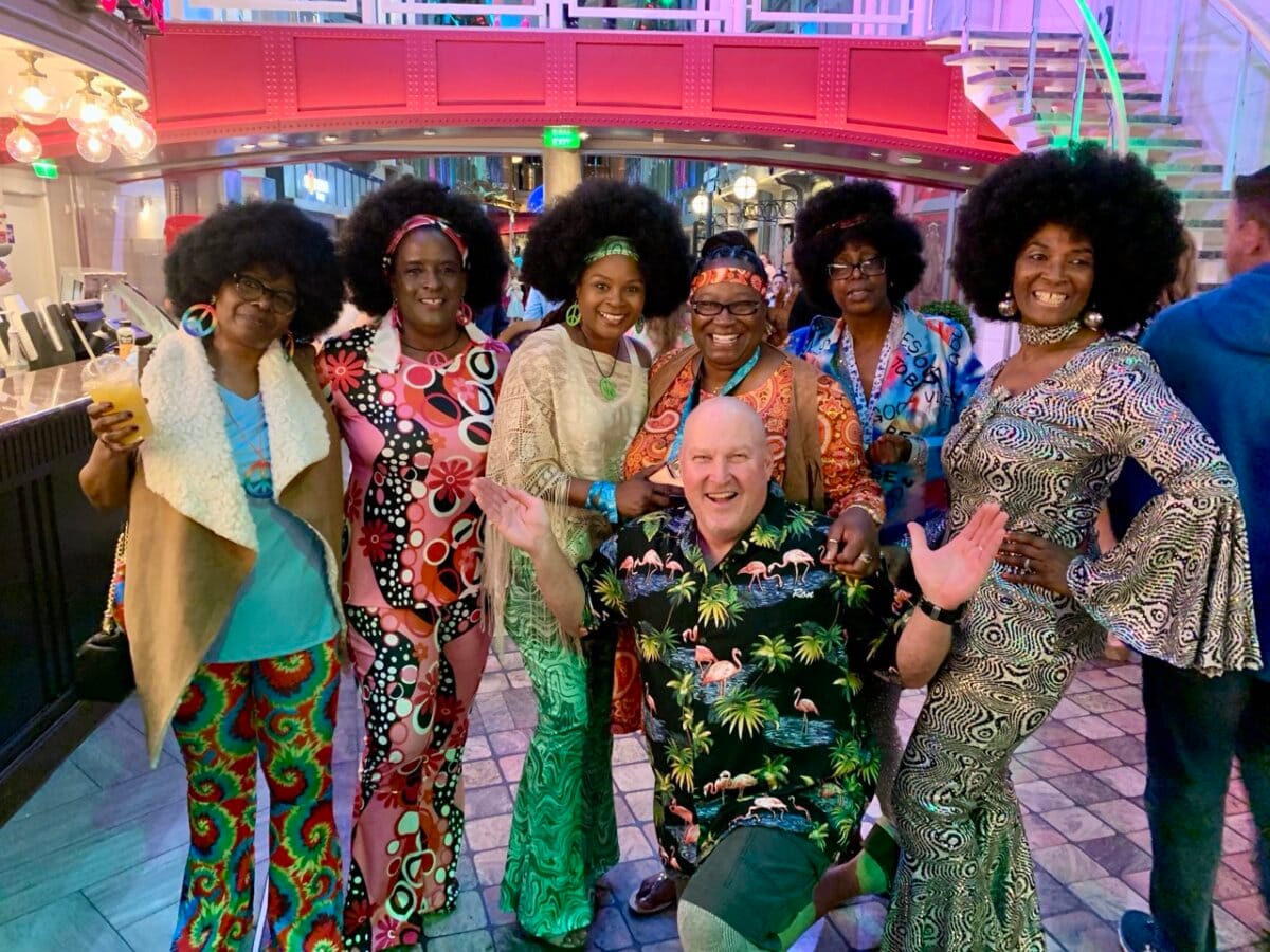 Six woman dressed up for 70s disco night onboard Allure of the Seas