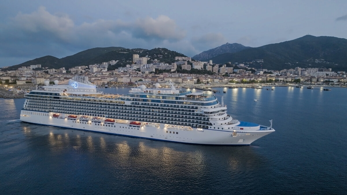 Oceania Vista sailing at night in Corsica