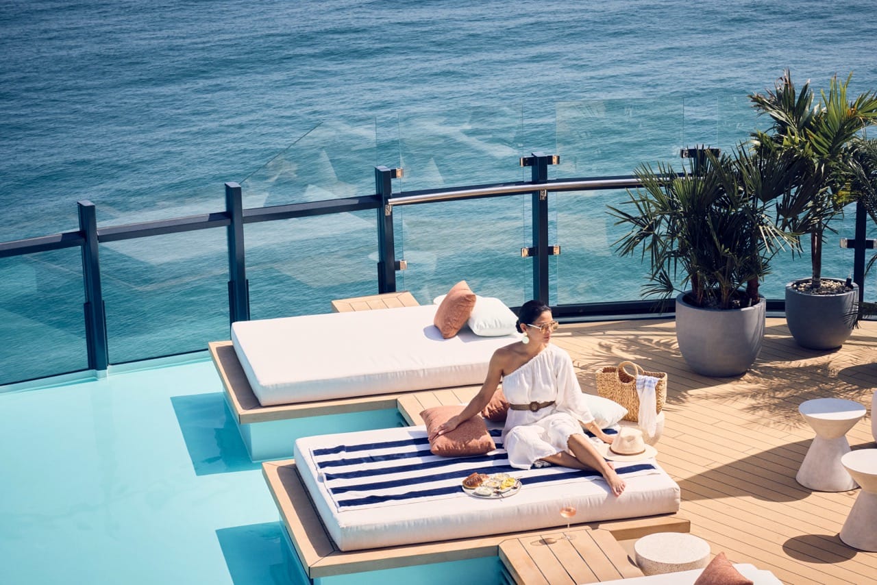 Ritz Carlton Cruise - Yacht Collection couple at pool