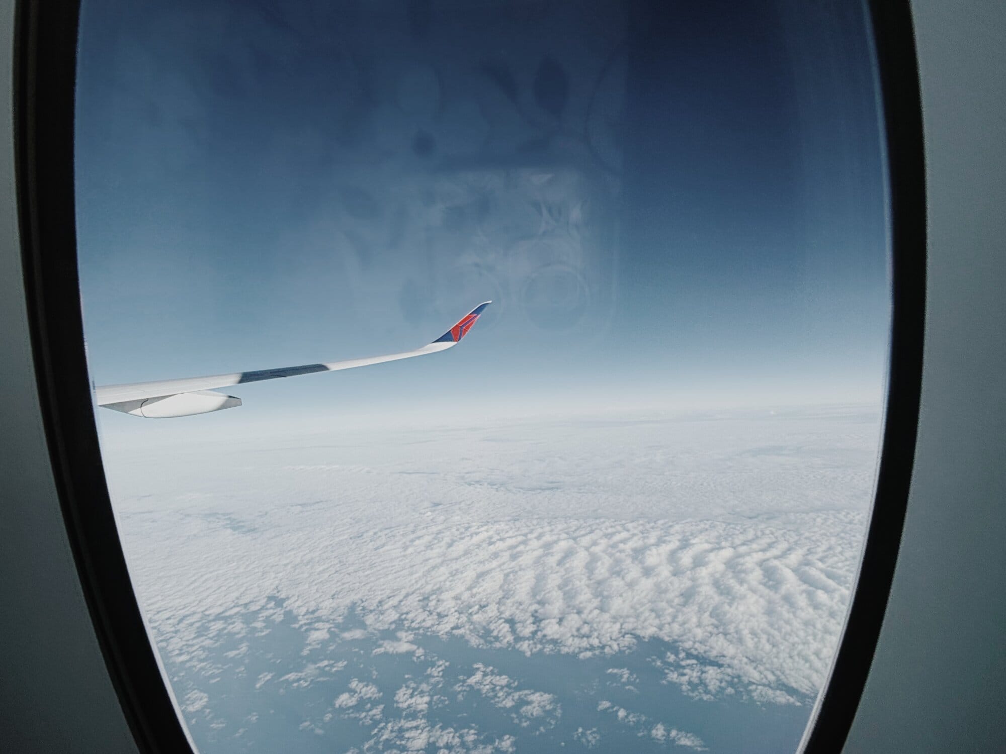 Delta Air Lines wing through plane window